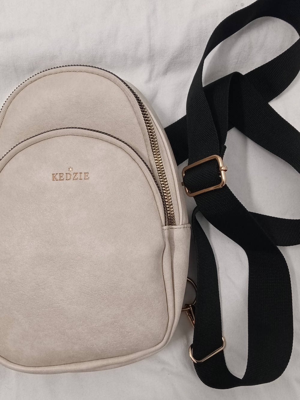 Kedzie Cream/Shell Sunset Sling Bag Black Adjustable Strap Vegan Leather